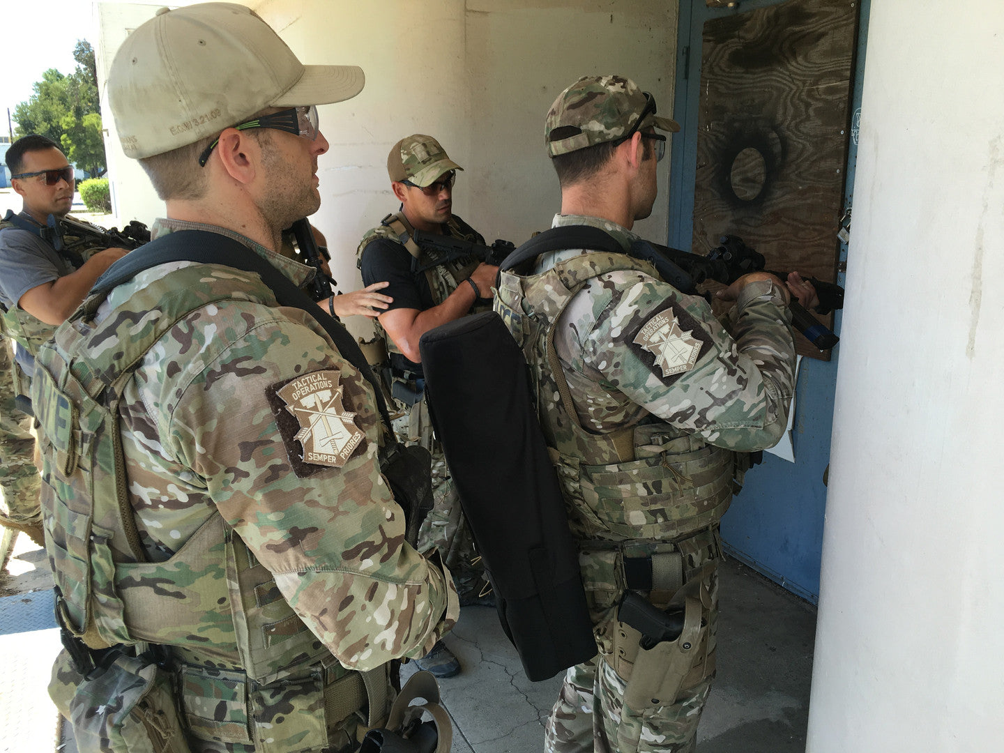 Team entering building with REM bundle