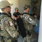 Team entering building with REM bundle